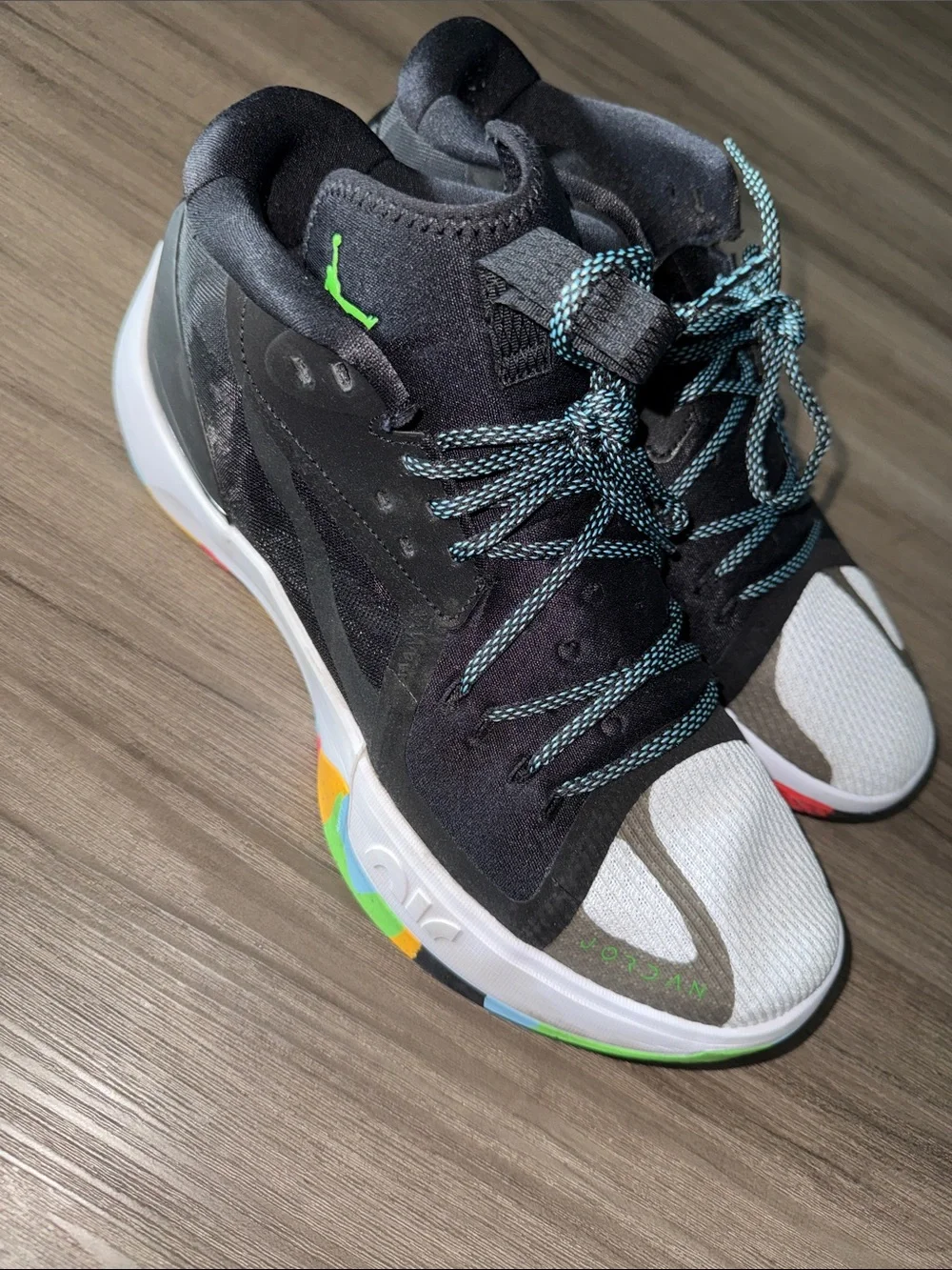 Jordan Black High-Top Sneaker with Green Jumpman and Multicolor Sole